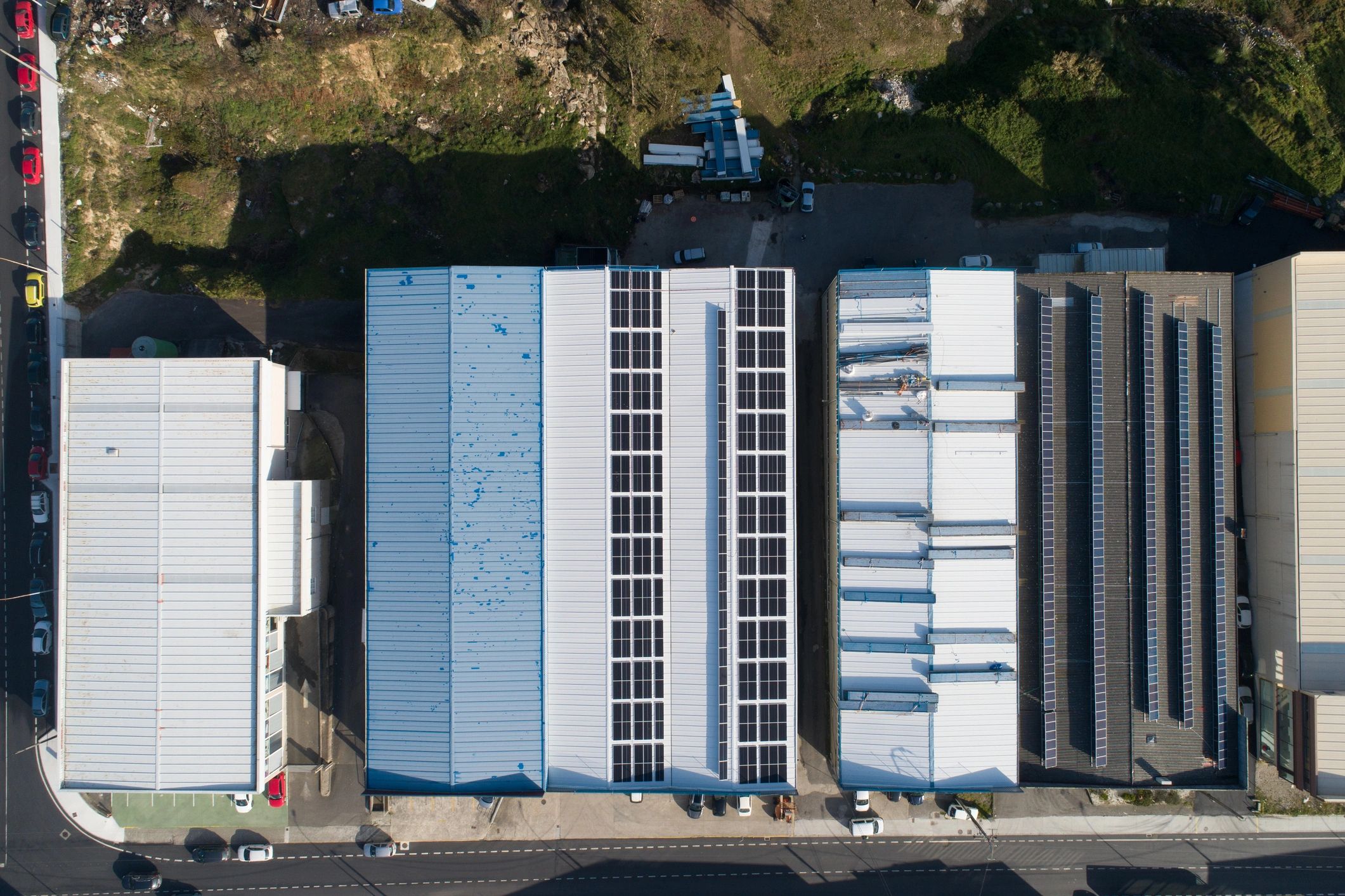 Aerial view solar panels on industrial building rooftops